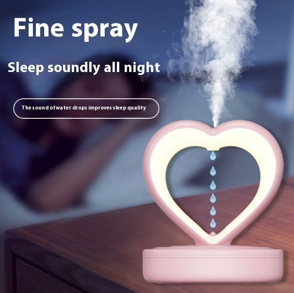 Shopi Vella water droplet backflow humidifier emitting fine spray with heart-shaped design on wooden table