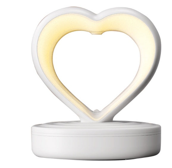 Shopi Vella heart-shaped water droplet backflow humidifier with soft ambient light in white