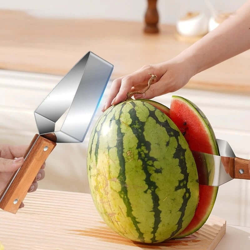 Shopi Vella watermelon cutter stainless steel with wooden handles slicing a watermelon in kitchen
