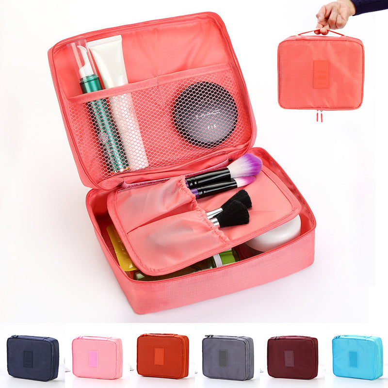Shopi Vella waterproof cosmetic organizer with pockets in coral pink holding makeup brushes and beauty products