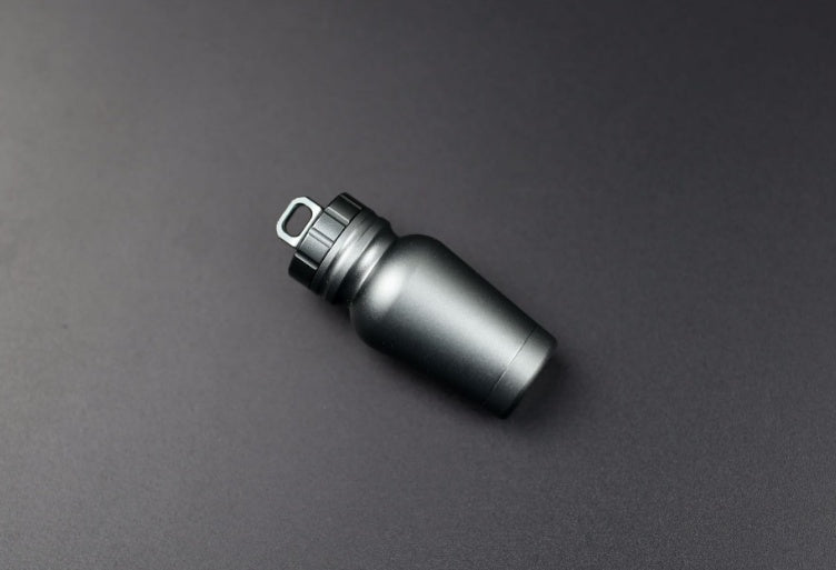 Shopi Vella waterproof medicine bottle for outdoors in sleek black storage bottle design