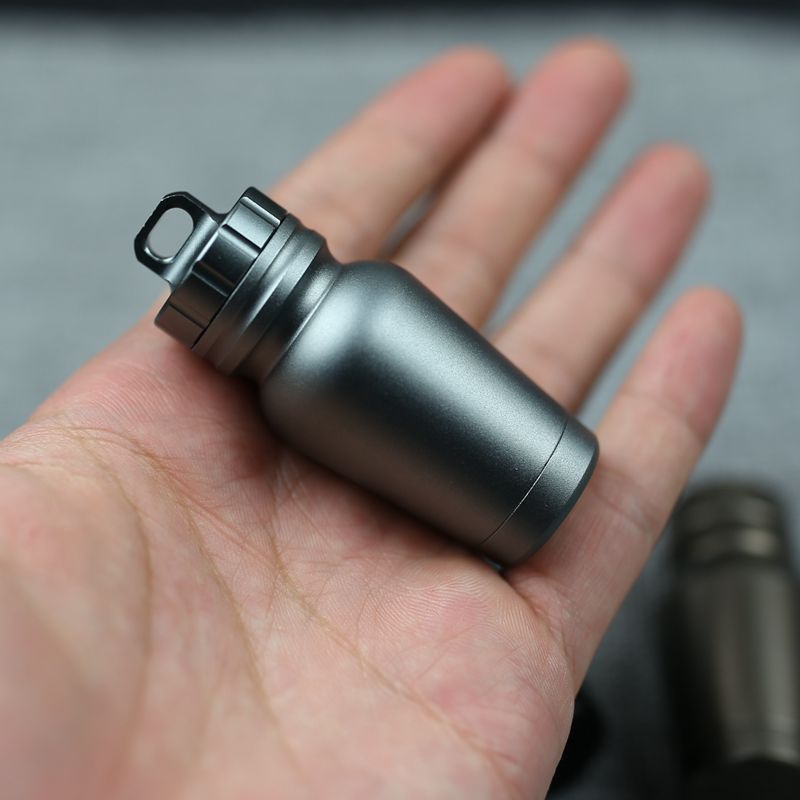 Shopi Vella waterproof medicine bottle for outdoors in compact metal design held in hand