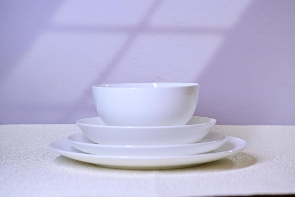 Shopi Vella white dinnerware set for 4 with bowl, salad plate, and dinner plate stacked neatly