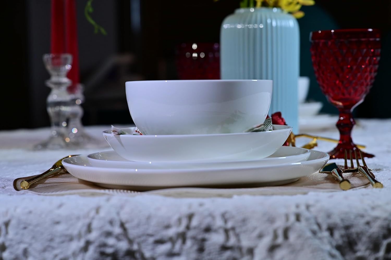 Shopi Vella white dinnerware set for 4 with plates and bowls neatly stacked on a table