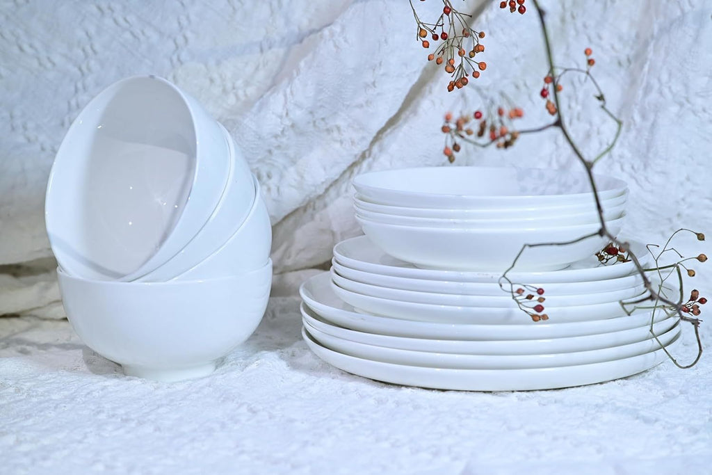 Shopi Vella white dinnerware set for 4 including bowls and plates on a textured surface