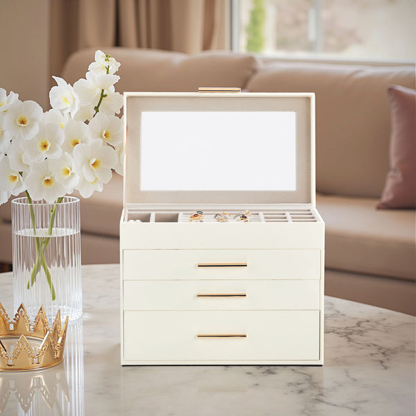 Shopi Vella white jewelry storage box with mirror and three drawers on marble table with orchids