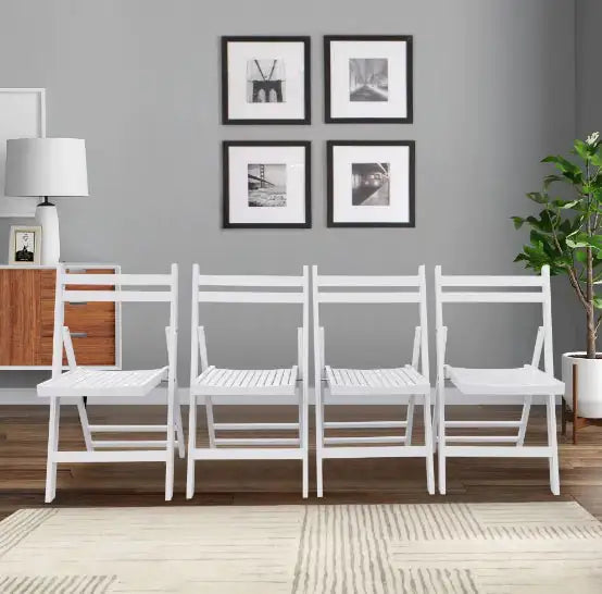 White slatted wood folding event chair set neatly arranged in a modern living room