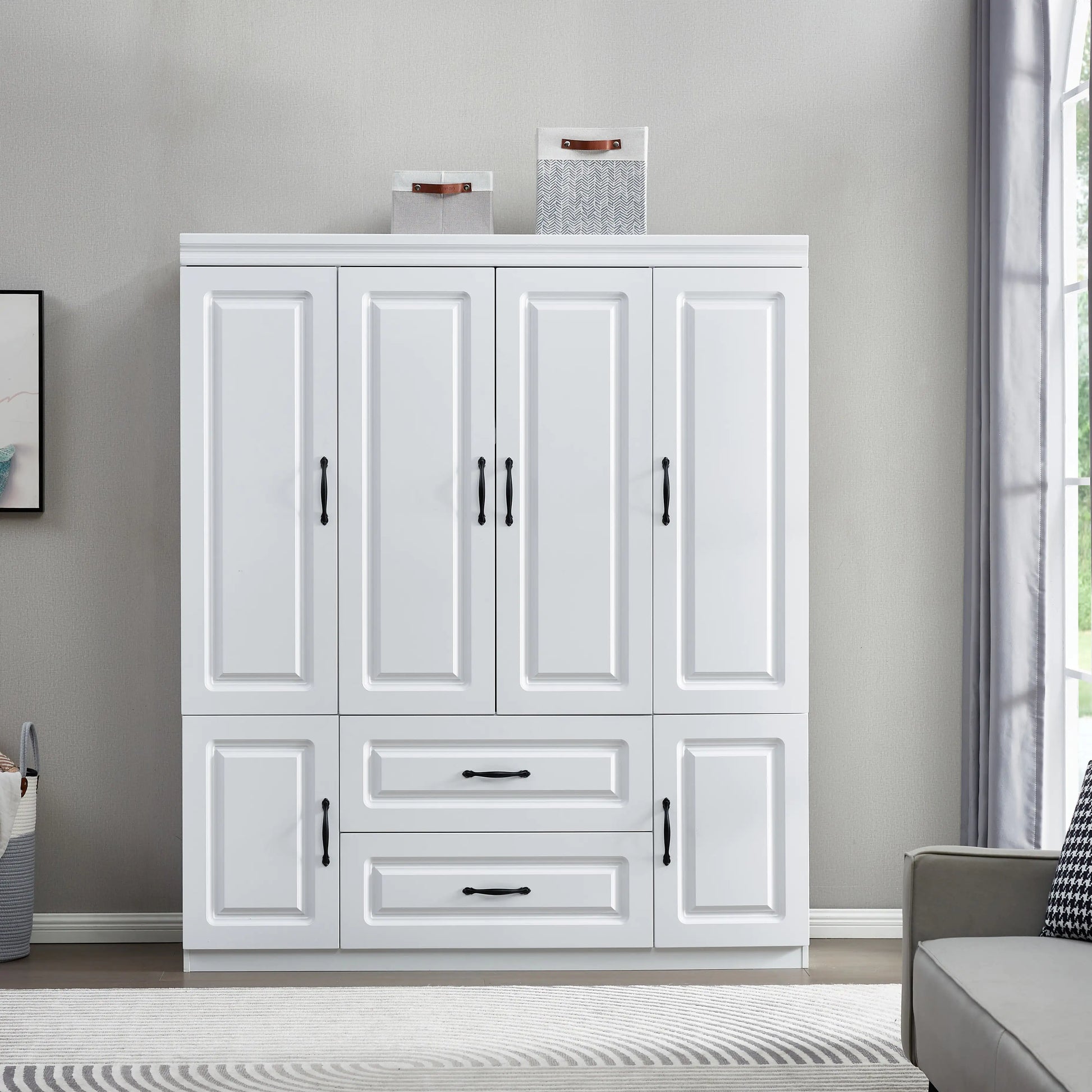 White solid wood wardrobe closet with multiple doors and drawers in modern living room