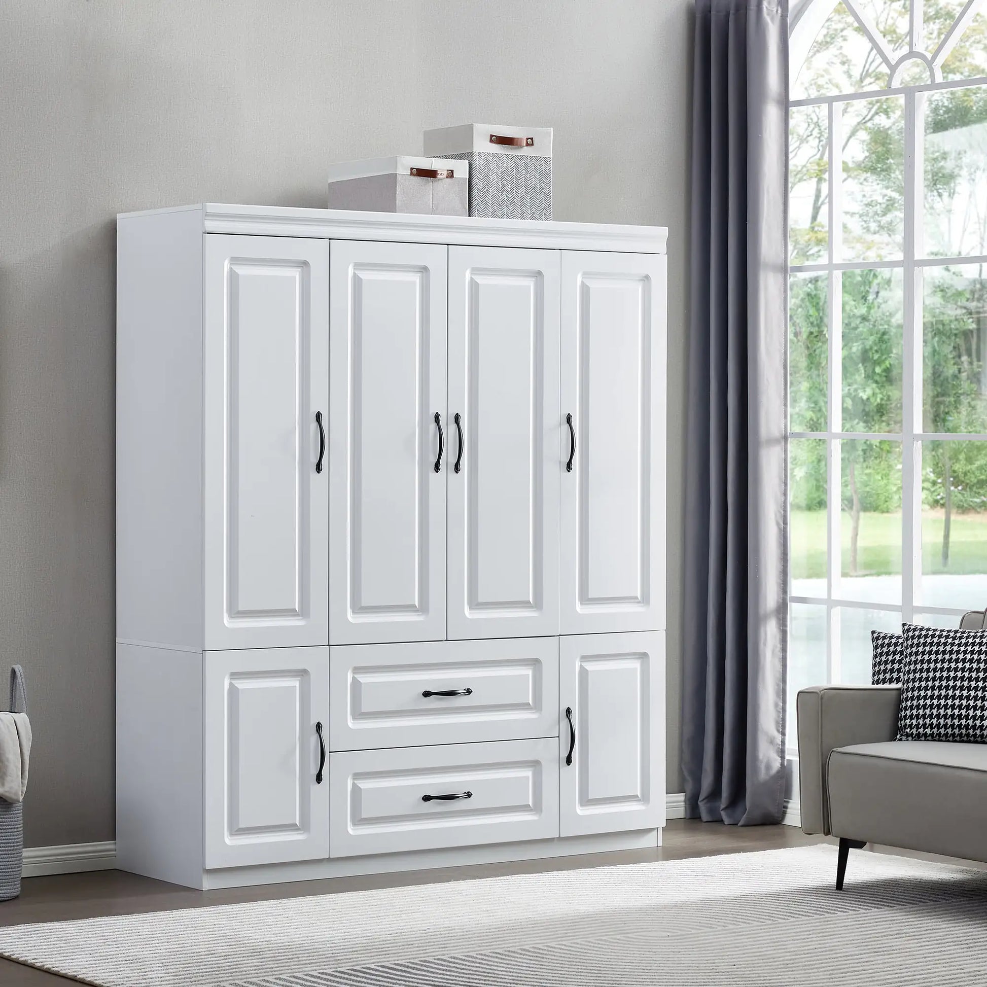 White solid wood wardrobe closet with multiple doors and drawers in a modern living room