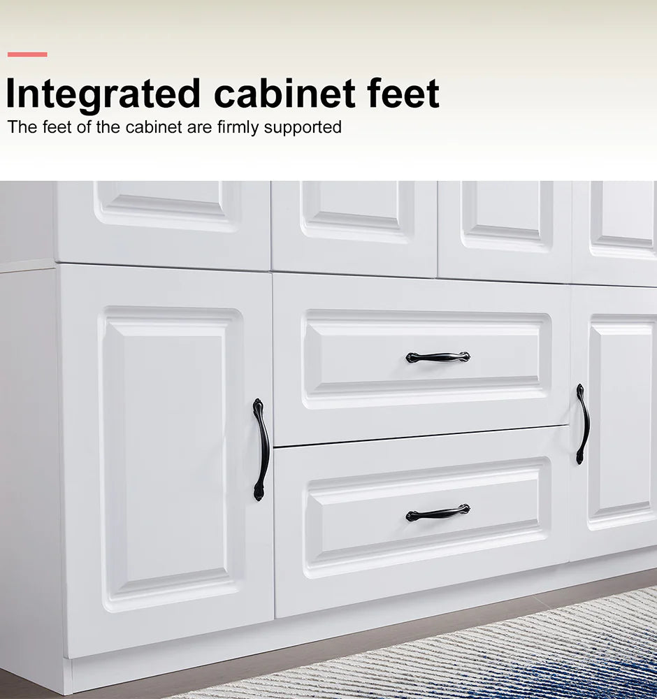Close-up of integrated cabinet feet on white solid wood wardrobe closet with black handles