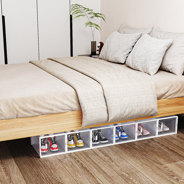 Shopi Vella white stackable shoe box set neatly storing various sneakers under a wooden bed frame