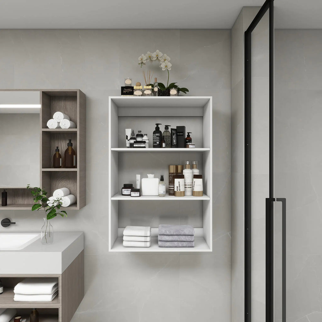 Modern white wall mounted bathroom shelves with toiletries towels and decorative orchid in a stylish bathroom