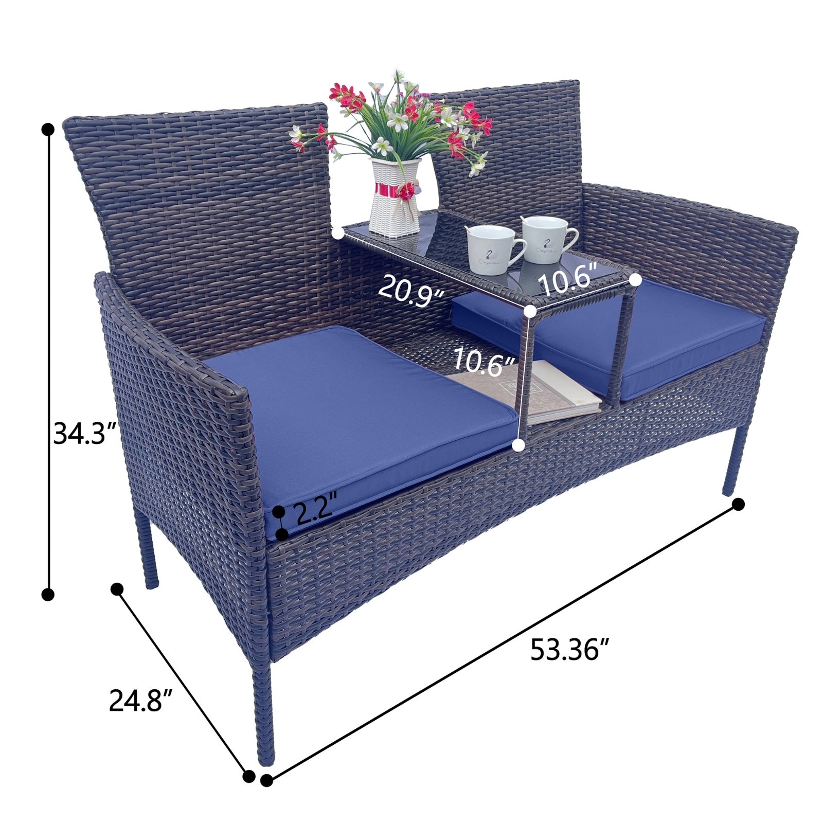Shopi Vella wicker patio furniture set with two seats, navy cushions, and center table with flower vase