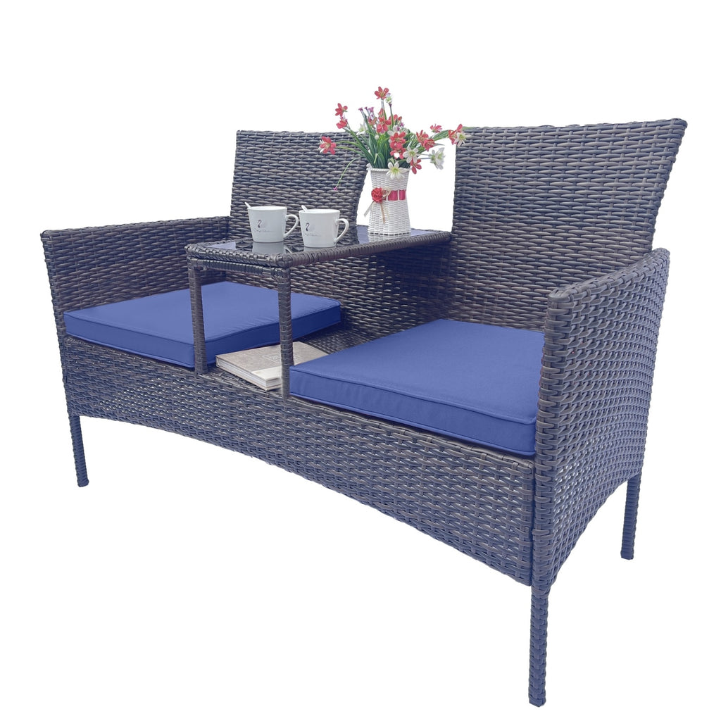 Shopi Vella wicker patio furniture set with dark woven frame and blue cushions featuring built-in center table