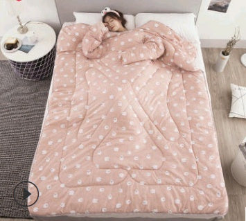 Shopi Vella winter quilt with sleeves in pink featuring white polka dots for cozy warmth