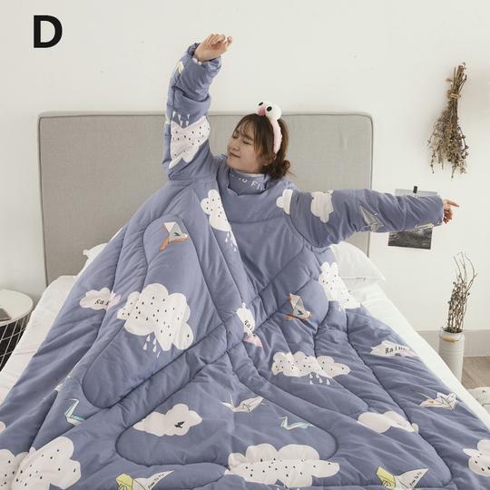Shopi Vella winter quilt with sleeves in blue featuring cloud and paper plane patterns