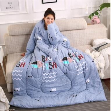 Shopi Vella winter quilt with sleeves in blue featuring bird and wave patterns for cozy comfort