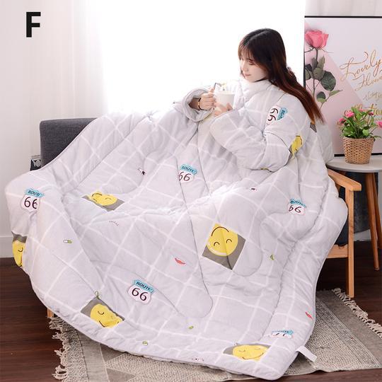 Shopi Vella white winter quilt with sleeves featuring smiley face and Route 66 designs worn by woman