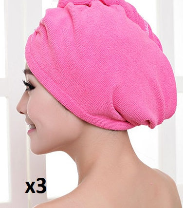 Pink women's hair drying towel wrapped around a woman's head for fast hair drying