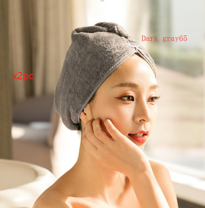 Woman wearing dark gray women's hair drying towel made of soft absorbent fabric