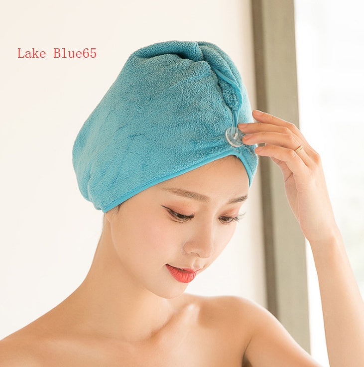 Woman wearing a lake blue women's hair drying towel wrapped securely around her head