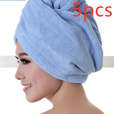 Blue women's hair drying towel wrapped around head showing soft absorbent fabric