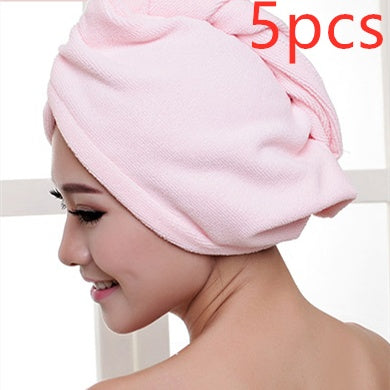 Pink women's hair drying towel wrapped around a woman's head soft and absorbent