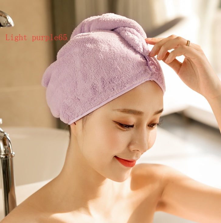 Light purple women's hair drying towel wrapped around a woman's head after a shower