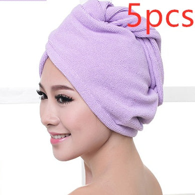 Light purple women's hair drying towel wrapped around a smiling woman’s head