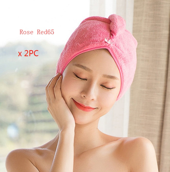Woman wearing pink women's hair drying towel wrapped around head for quick drying