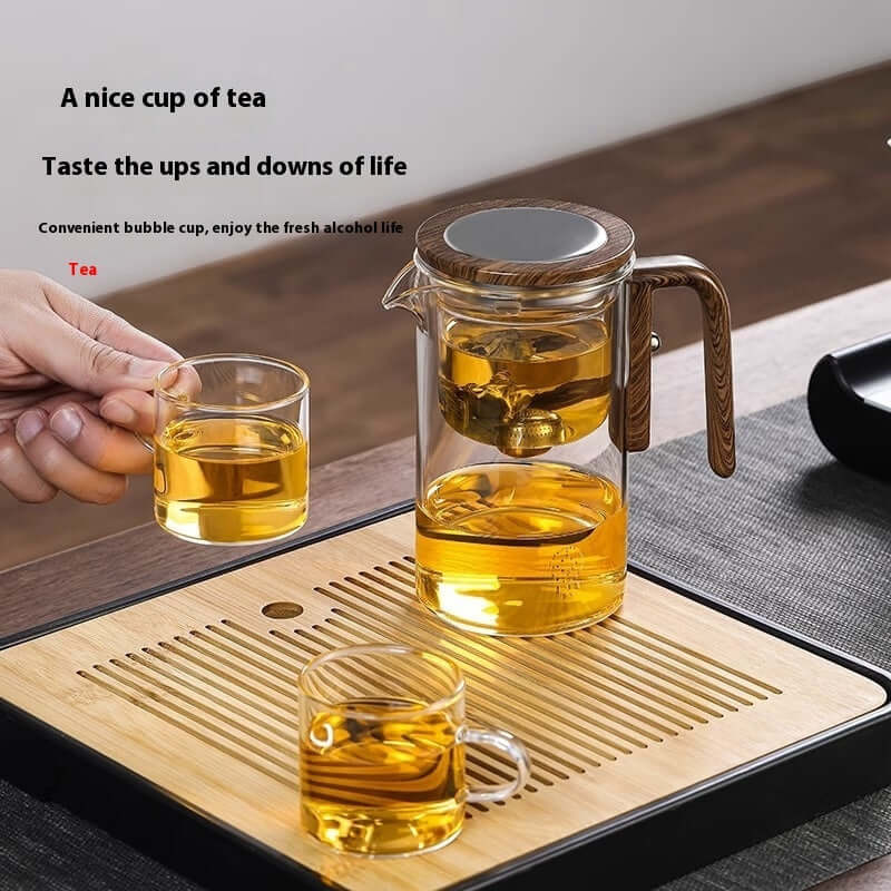 Shopi Vella wood handle tea separation pot with glass cups on a bamboo tray for kitchen storage