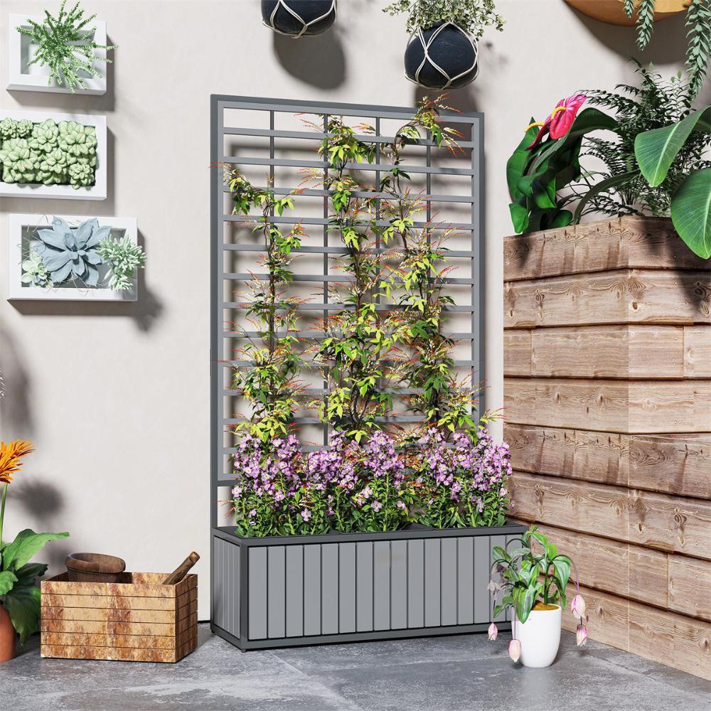 Wooden raised garden bed with trellis filled with flowering plants and vines in an indoor garden space