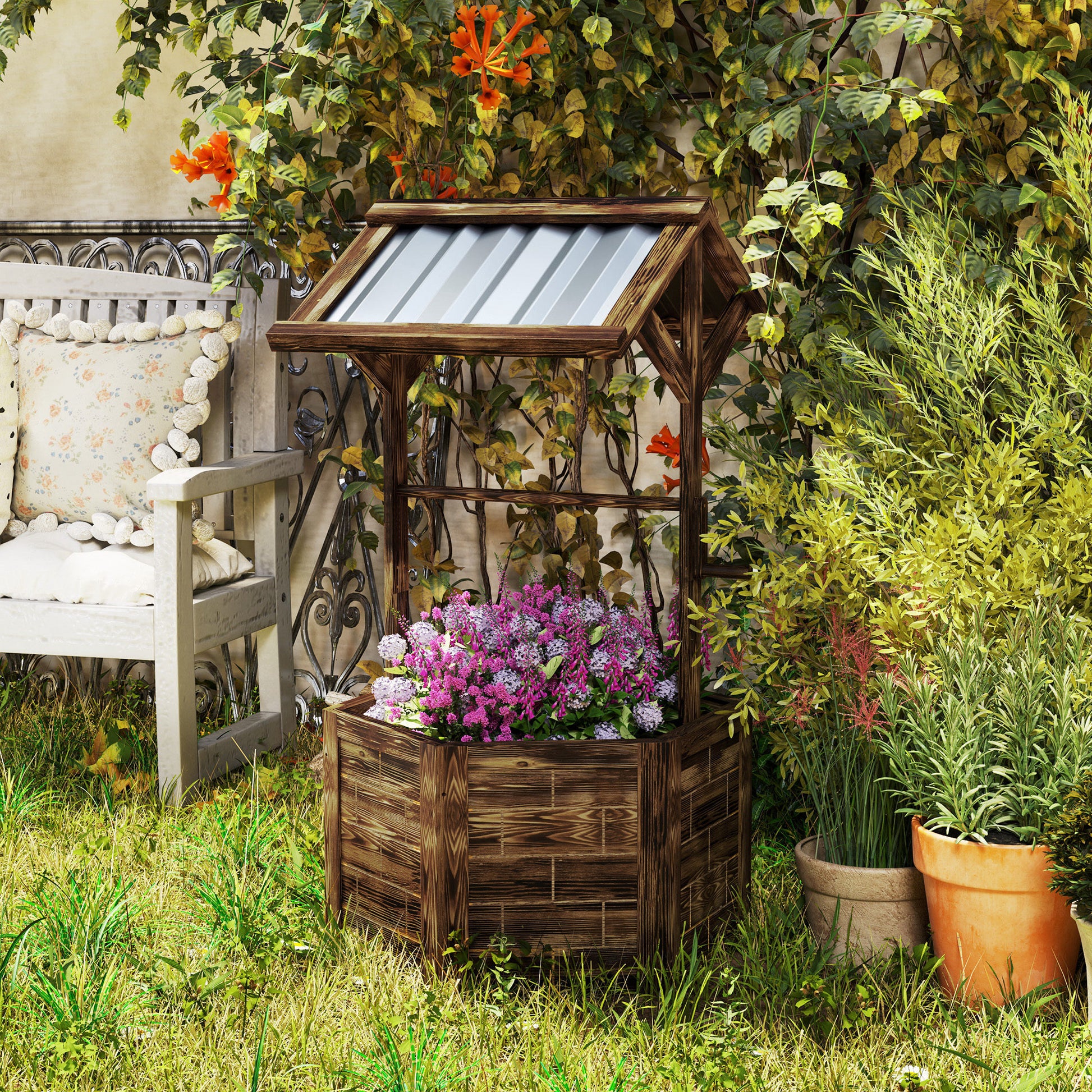 Shopi Vella wooden wishing well planter with purple flowers in a garden next to a bench and green plants