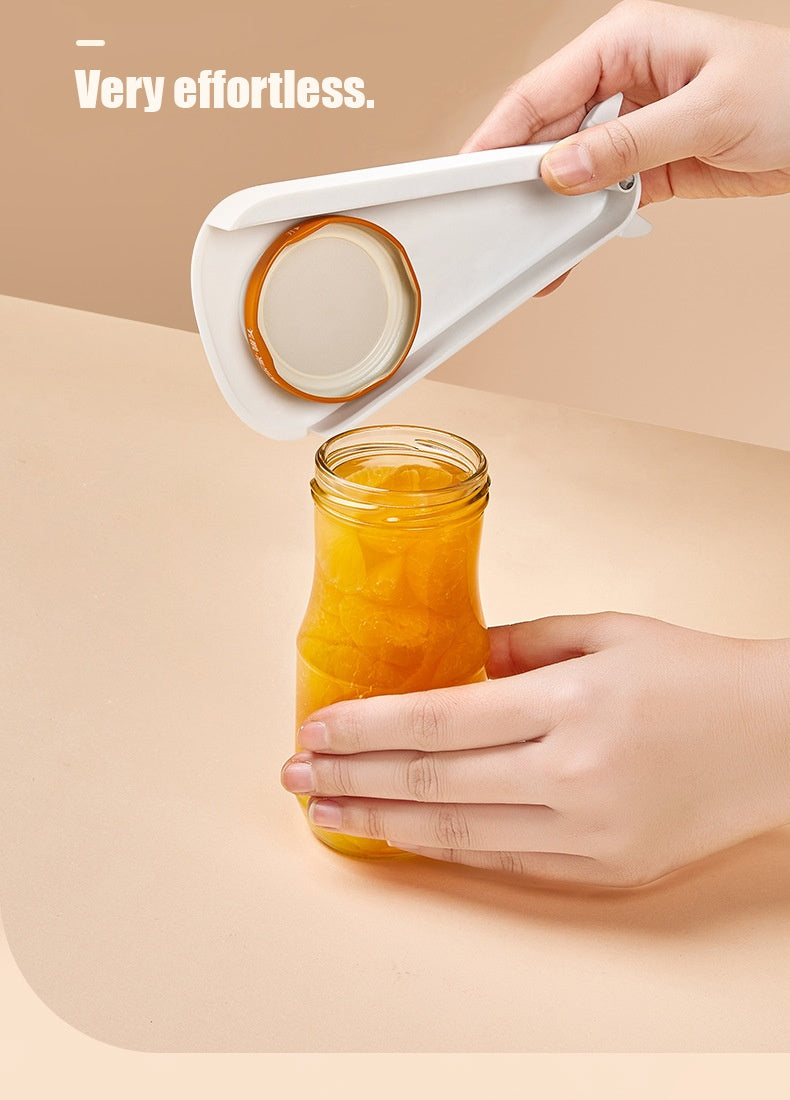 Shopi Vella rust proof jar and can opener opening a jar of orange preserves effortlessly