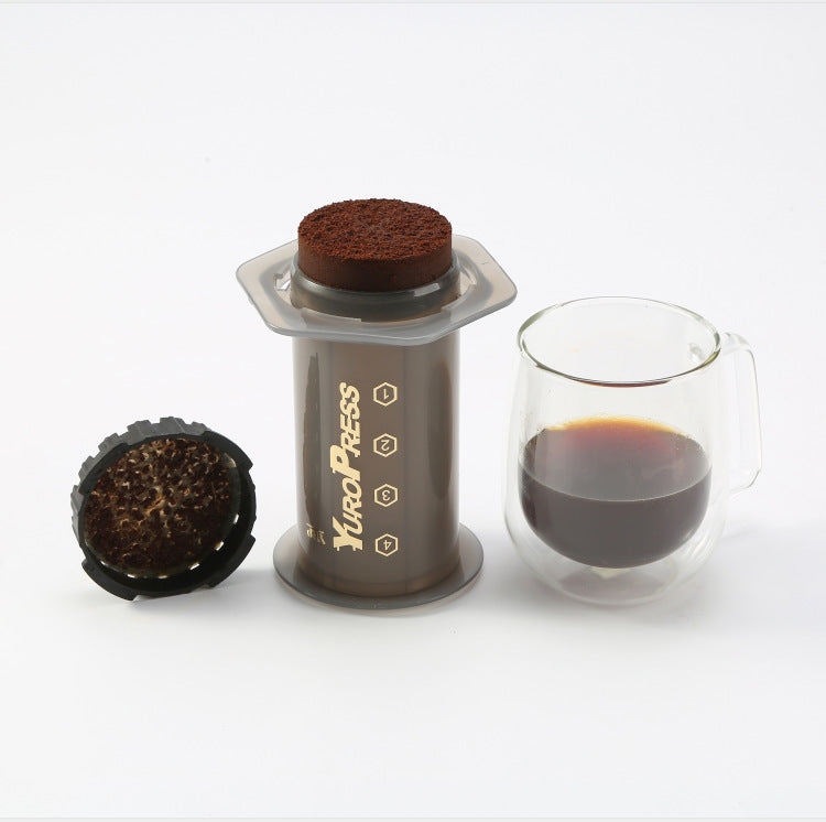 Shopi Vella EuroPress French press coffee maker with brewed coffee and filter parts on white background